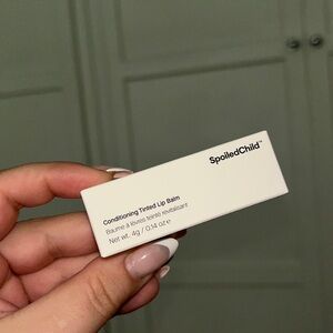 NEW, unopened Spoiled Child conditioning tinted lip balm. Natural Pink color